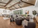 Open living space with hardwood floors, vaulted ceilings, and comfortable seating at 11826 River Shores Trl, Parrish, FL 34219