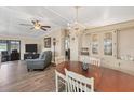 Spacious living room featuring gray couches and wood floors at 1532 46Th Avenue E Dr, Ellenton, FL 34222