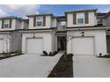 Two-story townhouse with attached garage and front landscaping at 11936 Sky Acres Ter, Bradenton, FL 34211