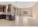 Bright and airy living room with tile flooring and access to a balcony at 7317 Skybird Rd # 7317, Bradenton, FL 34209