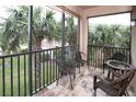 Relaxing screened balcony overlooking lush tropical landscape at 7317 Skybird Rd # 7317, Bradenton, FL 34209