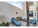 Secluded courtyard boasts plenty of lounge seating surrounded by lush greenery, providing the ultimate relaxation experience at 445 Palm Tree Dr, Bradenton, FL 34210