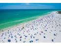 Beach aerial view showing many people enjoying the water and sand at 5855 Midnight Pass Rd # 416, Sarasota, FL 34242