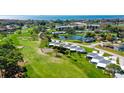 Aerial view of community near golf course and bay at 5923 43Rd W St, Bradenton, FL 34210