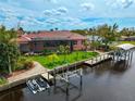 Expansive waterfront property with private dock and jet ski lift at 4409 Crews Ct, Port Charlotte, FL 33952