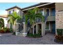 Exterior of condo with stairs and landscaping at 12720 Sorrento Way # 102, Bradenton, FL 34211