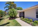 Screened patio area with walkway leading to a pond at 8047 Victoria Falls Cir, Sarasota, FL 34243