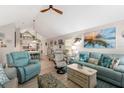 Bright and airy living room featuring vaulted ceilings and coastal decor at 4629 Whirlaway Dr # B, Sarasota, FL 34233