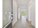 Bright and airy entryway with tile flooring and access to other rooms at 5307 Cappleman Loop, Brooksville, FL 34601