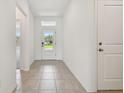 Spacious entryway with tile floors and natural light at 5307 Cappleman Loop, Brooksville, FL 34601