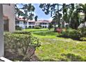 View of a tranquil pond and community from a window at 4264 Central Sarasota Pkwy # 116, Sarasota, FL 34238