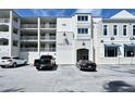 Harbor Villas condo building, three-story exterior with parking at 516 Tamiami S Trl # 102, Nokomis, FL 34275