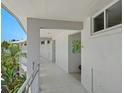 Clean condo hallway with light walls and modern decor at 100 Sands Point Rd # 305, Longboat Key, FL 34228