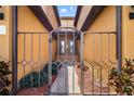 Private gated entry to condo with brick walkway and landscaping at 6918 Grand Estuary Trl # 102, Bradenton, FL 34212