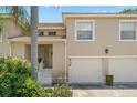 Townhome exterior featuring a well-maintained facade and attached garage at 6736 Fairview Ter # 6736, Bradenton, FL 34203