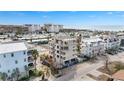 Aerial view of new construction home near beach, tennis courts, and pool at 1150 Windsong Ln # 200, Sarasota, FL 34242
