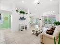 Bright living room with beige sofa and glass coffee table at 6655 41St Street E Cir, Sarasota, FL 34243