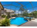 Screened-in pool and hot tub overlooking a beautiful lake at 7167 Whitemarsh Cir, Lakewood Ranch, FL 34202