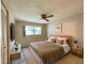 Main bedroom with king-size bed and wood flooring at 2687 Golf Course Dr # 219, Sarasota, FL 34234