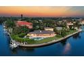 Waterfront property with pool, boat dock, and sunset views at 1701 Sandalwood Dr, Sarasota, FL 34231