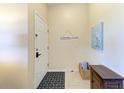 Inviting entryway featuring tiled flooring and a nautical welcome theme at 3607 E Bay Dr # 202, Holmes Beach, FL 34217