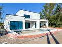 Backyard view featuring a new modern-style pool and large windows in an unfinished backyard at 2226 Grove St, Sarasota, FL 34239