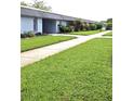 Charming single-story condo with well-maintained landscaping and inviting walkway leading to the front door at 4160 Fruitville Rd # 13, Sarasota, FL 34232