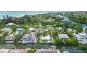 Aerial view of canal-front house near beach, showcasing its location at 562 Juan Anasco Dr, Longboat Key, FL 34228