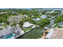 Property's canal-front location highlighted in this aerial view at 562 Juan Anasco Dr, Longboat Key, FL 34228
