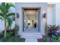 Modern front entrance with double doors opening to a view of the interior at 2430 Floyd St, Sarasota, FL 34239