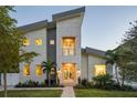 Contemporary two-story house with sleek design and landscaping at 2446 Floyd St, Sarasota, FL 34239