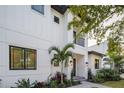 Stylish two-story home with white exterior and black windows at 2440 Floyd St, Sarasota, FL 34239