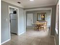 View of dining area and kitchen with white appliances at 2825 Sequoia Ln, Sarasota, FL 34237