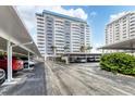 Parking garage with covered parking spaces for residents at 1750 Benjamin Franklin Dr # 2G, Sarasota, FL 34236