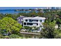 Waterfront property with expansive views and lush landscaping at 1610 N Lodge Dr, Sarasota, FL 34239