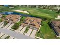 Luxury homes with tile roofs near a golf course at 5830 Wake Forest Run # 104, Bradenton, FL 34211