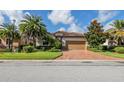 Single story home with tan colored garage door at 7112 Marsh View Ter, Bradenton, FL 34212