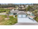 Waterfront home boasts a three-car garage and private boat parking at 613 Elba Dr, Nokomis, FL 34275