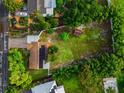 Overhead view showcasing home and expansive lot with lush greenery at 329 Bay Vista Ave, Osprey, FL 34229