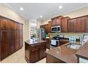 Well-equipped kitchen featuring a center island, stainless steel appliances, and ample cabinet space at 105 New Briton Ct, Bradenton, FL 34212