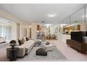 Spacious living room with beige carpet and modern furniture at 4109 66Th Street W Cir # 4109, Bradenton, FL 34209