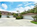 Attractive townhouses with attached garages and lush landscaping at 7673 Fairway Woods Dr # 706, Sarasota, FL 34238