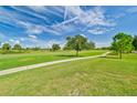 Landscaped golf course with walking path at 26336 Nadir Rd # 12, Punta Gorda, FL 33983