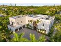 Luxury waterfront home boasting a rooftop pool and expansive patio at 3482 Flamingo Ave, Sarasota, FL 34242