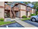 Building entrance with stairs and walkway at 5026 Water Oak Dr # 112, Bradenton, FL 34207