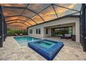 Relaxing pool and spa with covered patio; perfect for outdoor entertaining at 8933 Isabella Cir, Parrish, FL 34219