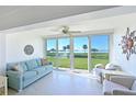 Bright living room with water view and comfy seating at 4731 Independence Dr # 4731, Bradenton, FL 34210