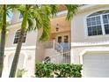 Two story house with a spiral staircase and double doors at 4931 Oxford Dr, Sarasota, FL 34242