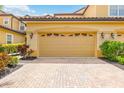 Attached garage with paved driveway at 8106 Miramar Way, Lakewood Ranch, FL 34202