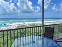 Relaxing screened balcony overlooking the beach at 1900 Gulf N Dr # 4, Bradenton Beach, FL 34217